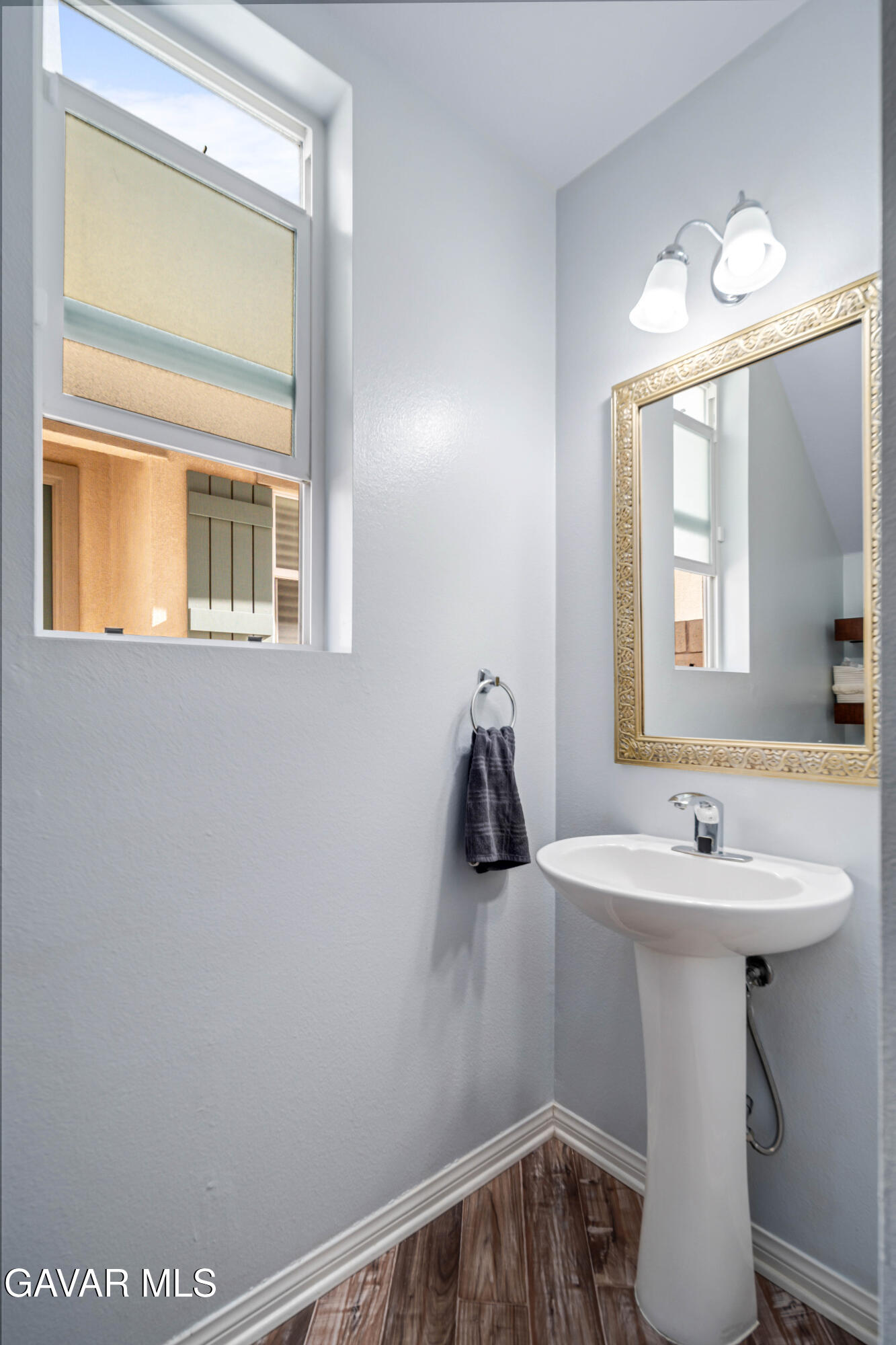 19849 Via Ott Santa Clarita, CA 91321 - Photo 26 of 52 a bathroom with a sink and a mirror