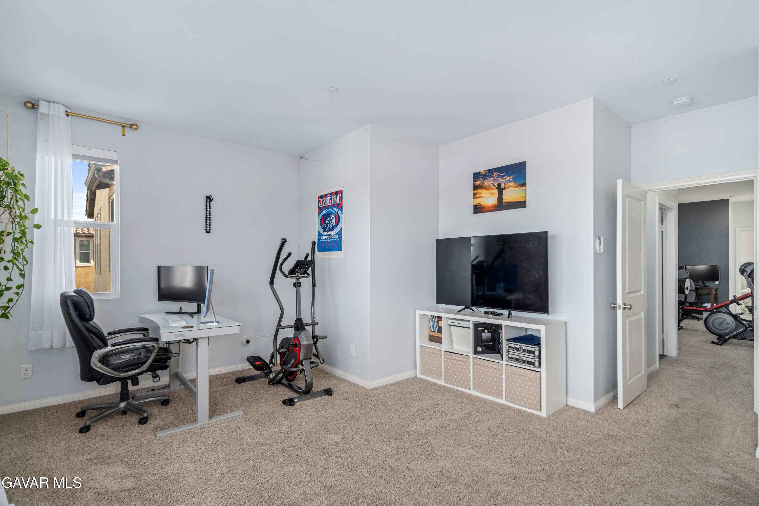 19849 Via Ott Santa Clarita, CA 91321 - Photo 33 of 52 a view of a livingroom with furniture and a flat screen tv