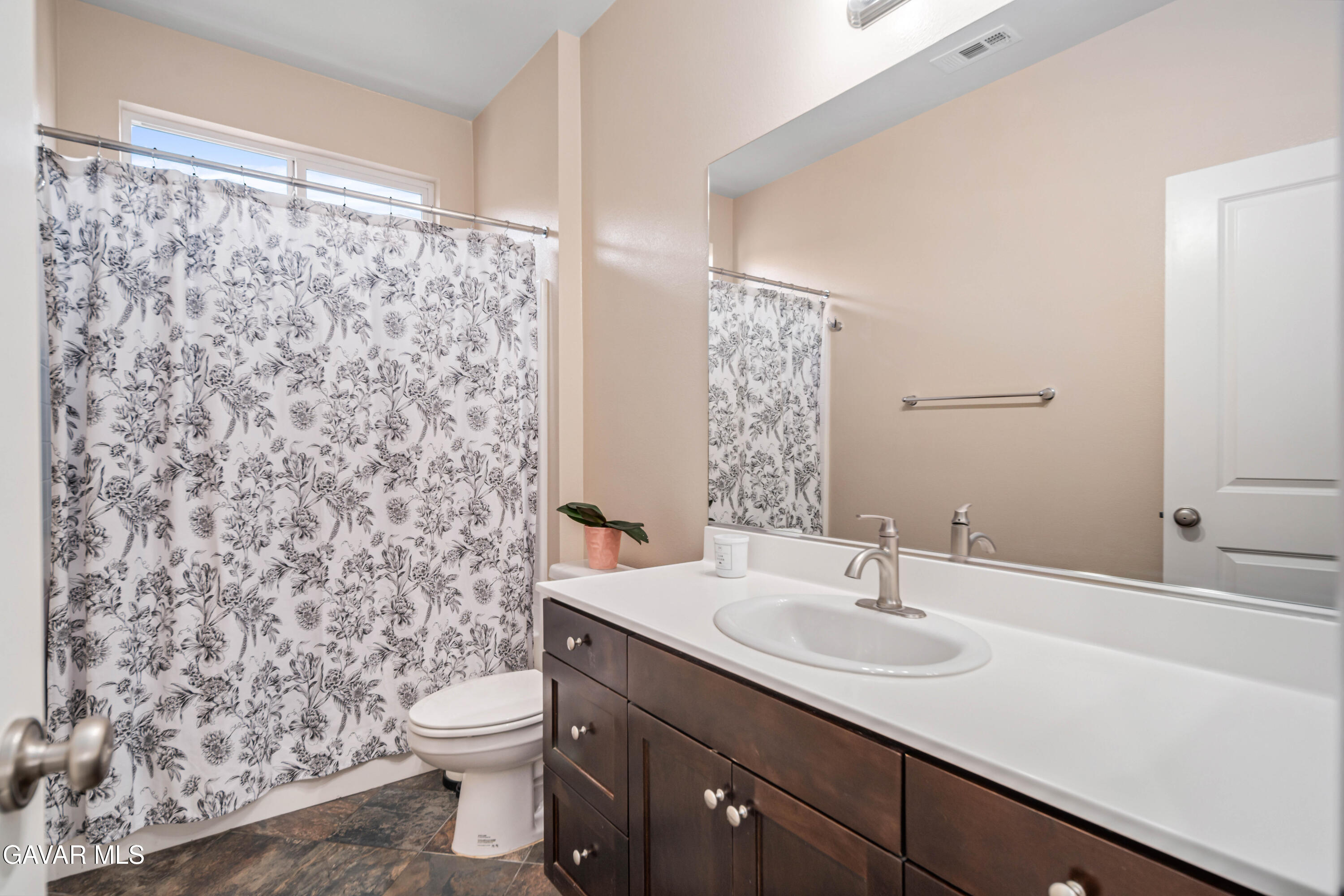 19849 Via Ott Santa Clarita, CA 91321 - Photo 45 of 52 a bathroom with a sink toilet and shower