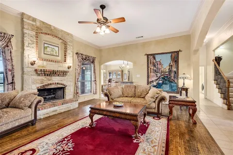 a kitchen with stainless steel appliances granite countertop a stove refrigerator and cabinets