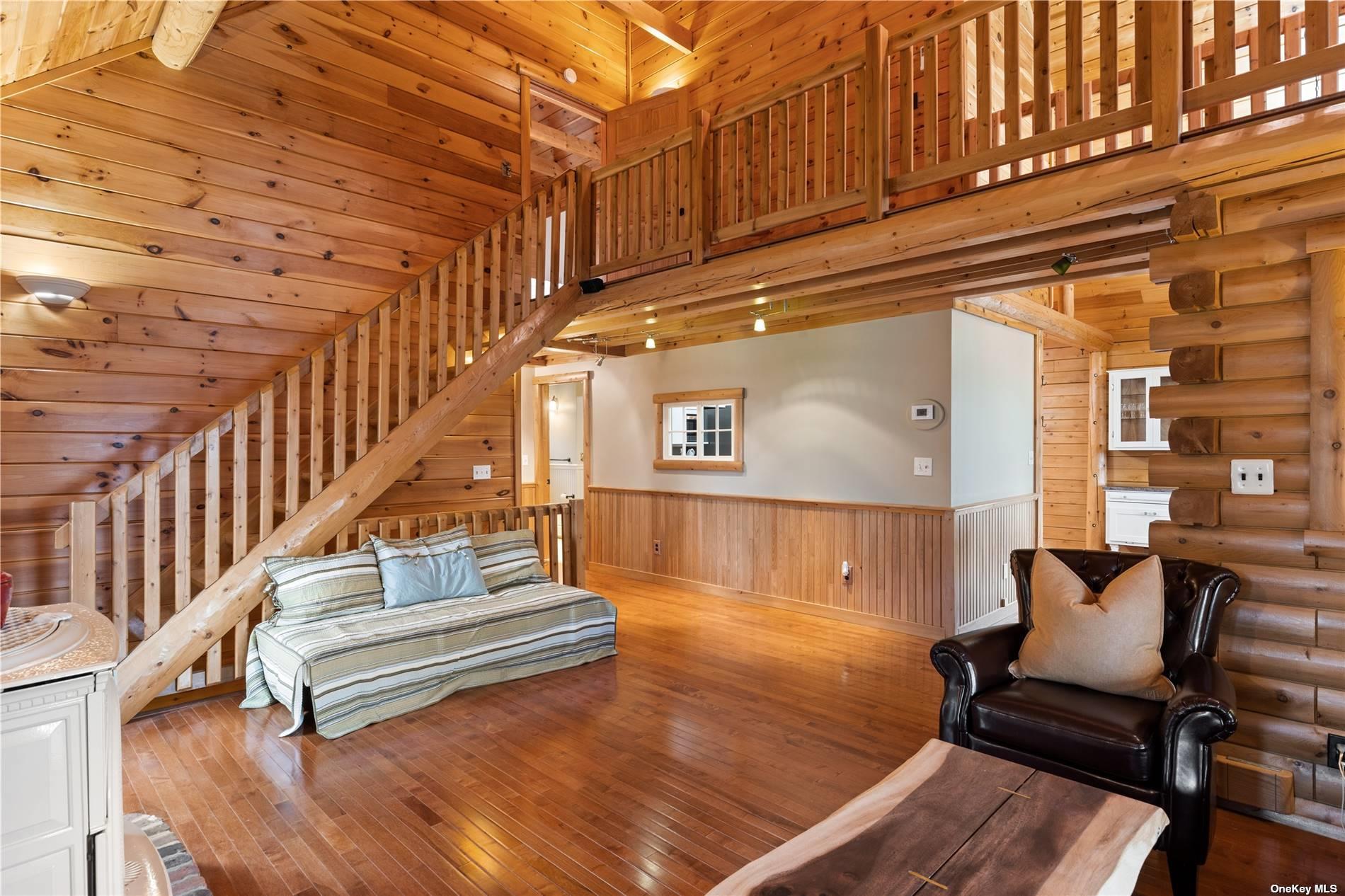 380 Private Road Southold, NY 11971 - Photo 18 of 31 a view of entryway livingroom and hall with wooden floor