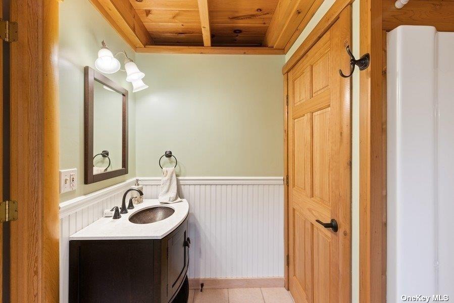 380 Private Road Southold, NY 11971 - Photo 20 of 31 a bathroom with a sink and a mirror