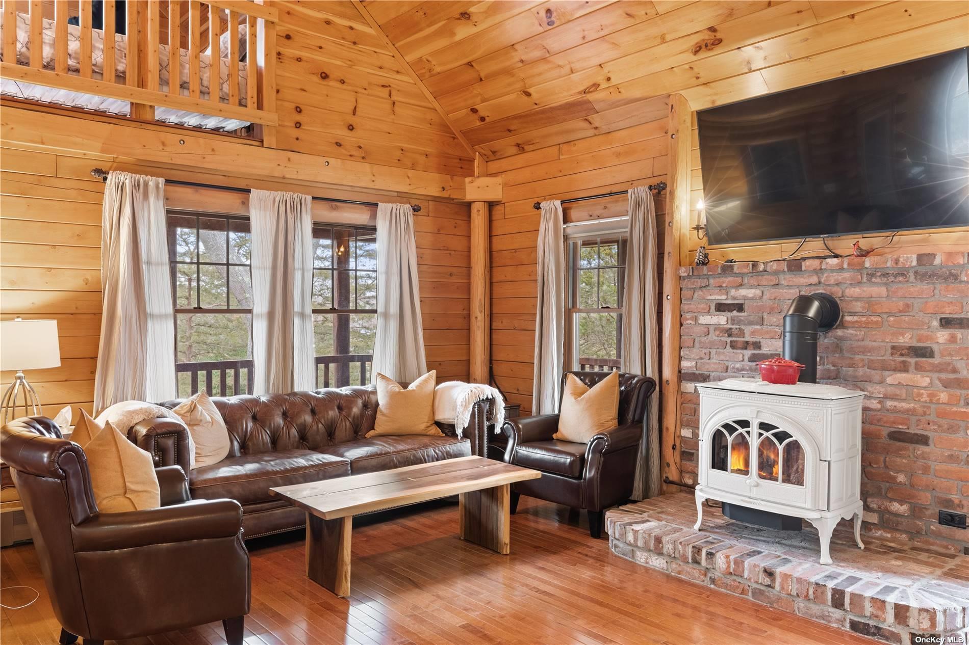 380 Private Road Southold, NY 11971 - Photo 3 of 31 a living room with furniture fireplace and flat screen tv