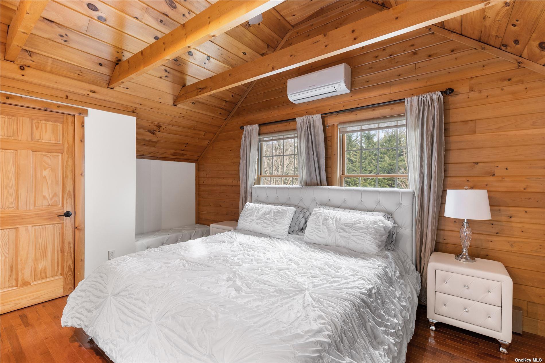 380 Private Road Southold, NY 11971 - Photo 6 of 31 a bedroom with a bed and a window