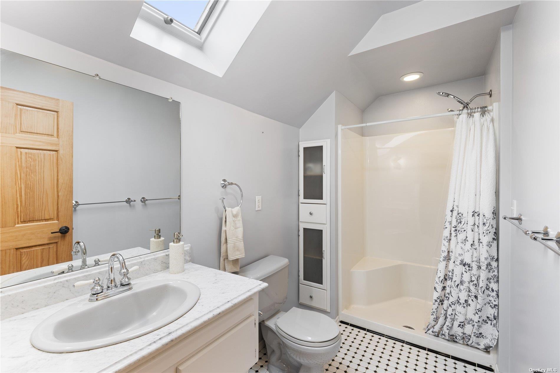 380 Private Road Southold, NY 11971 - Photo 7 of 31 a bathroom with a sink toilet and shower