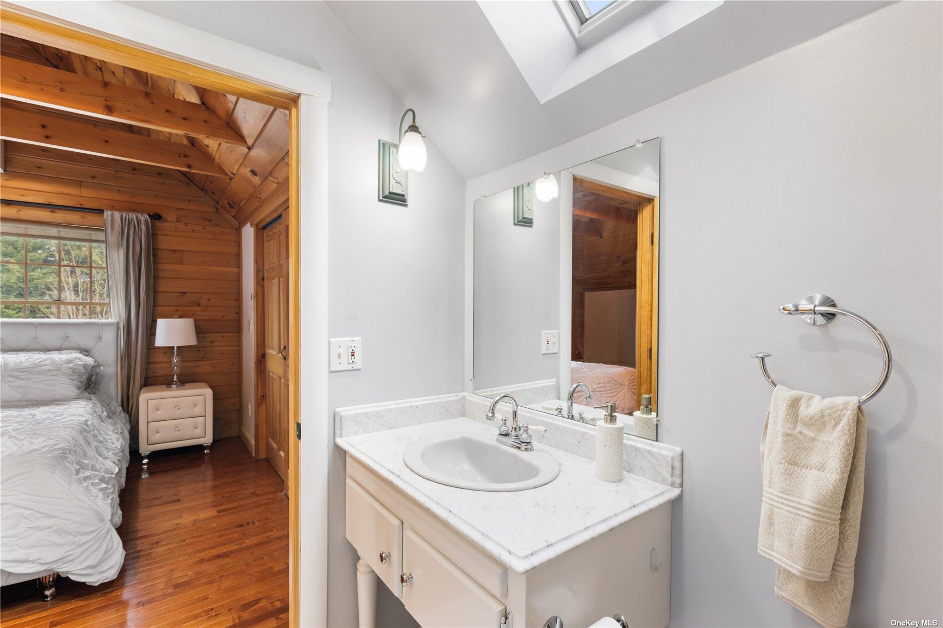 380 Private Road Southold, NY 11971 - Photo 8 of 31 a bathroom with a sink and a mirror