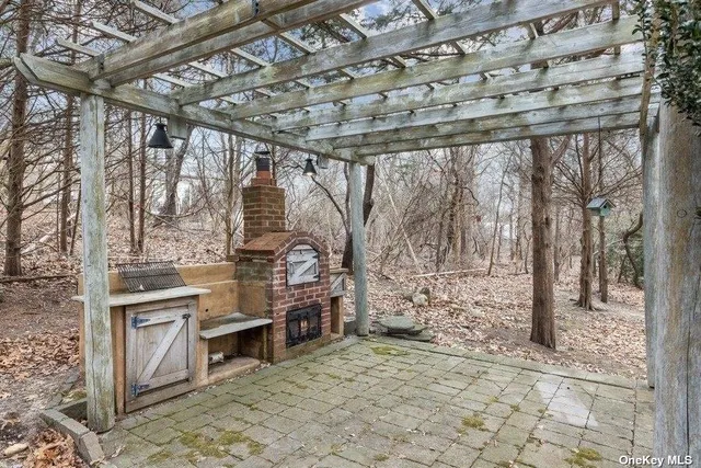 a view of a room with wooden floor and iron stairs