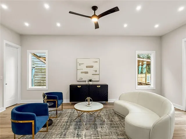 a view of a deck with wooden floor and fence