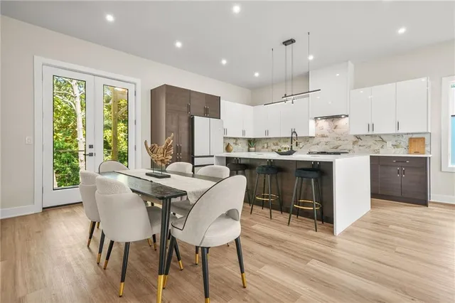 a living room with furniture or couch and a dining table