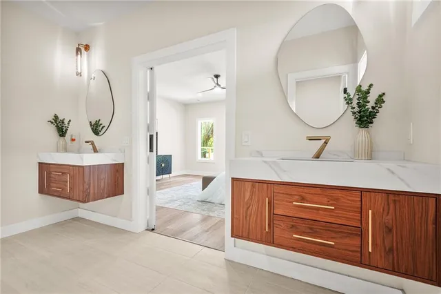 a view of a livingroom with a sink and wooden floor