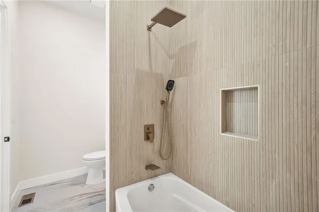 a kitchen with a table chairs refrigerator and microwave