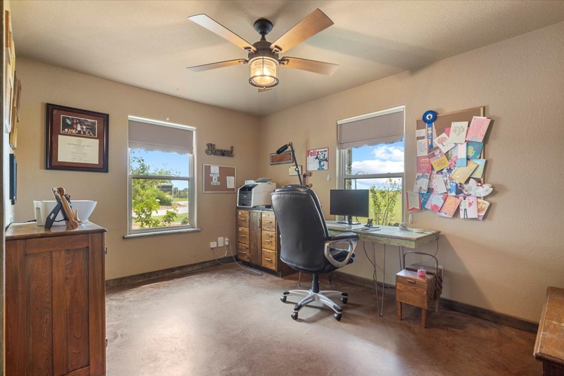 7835 Berger Road Schulenburg, TX 78956 - Photo 18 of 40 Office area featuring finished concrete floors, plenty of natural light, and ceiling fan