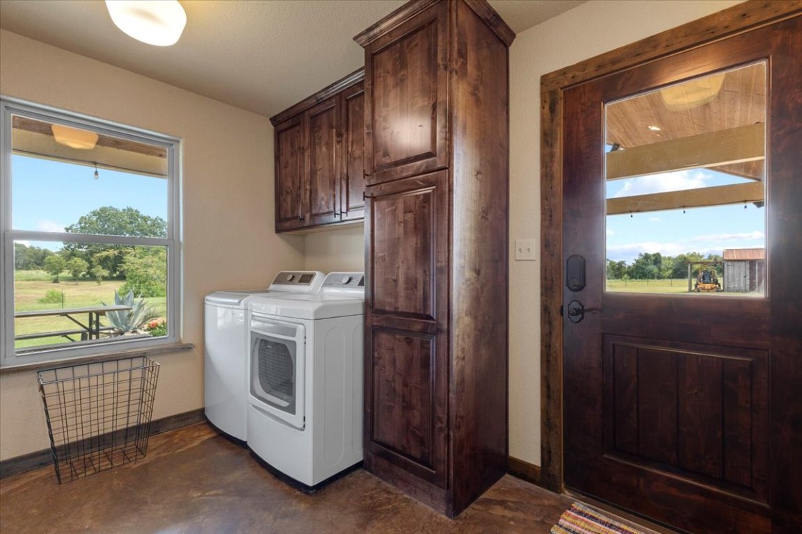 7835 Berger Road Schulenburg, TX 78956 - Photo 23 of 40 Washroom with cabinet space and separate washer and dryer