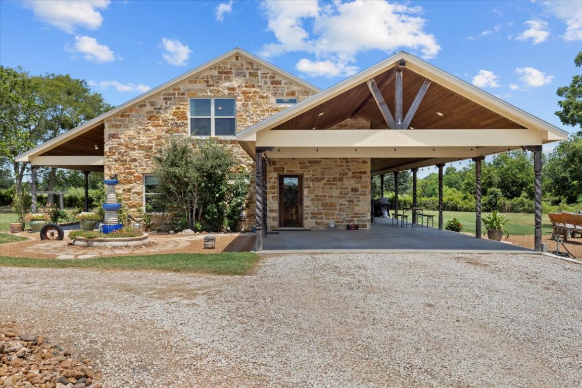 7835 Berger Road Schulenburg, TX 78956 - Photo 7 of 40 View of property's concrete floored attached carport and driveway
