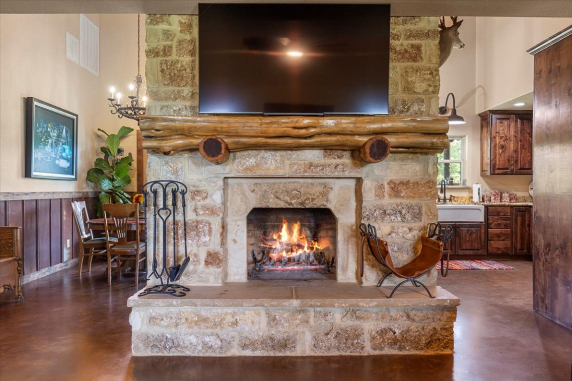 7835 Berger Road Schulenburg, TX 78956 - Photo 9 of 40 Mantel was handmade from cedar tree off the property. Cave select stone-Elevate your architectural and landscaping projects with the unparalleled, unique beauty of our Cave Select Limestone Block. Crafted by nature and hewn by skilled artisans, this remarkable stone brings a touch of timeless elegance to any setting.