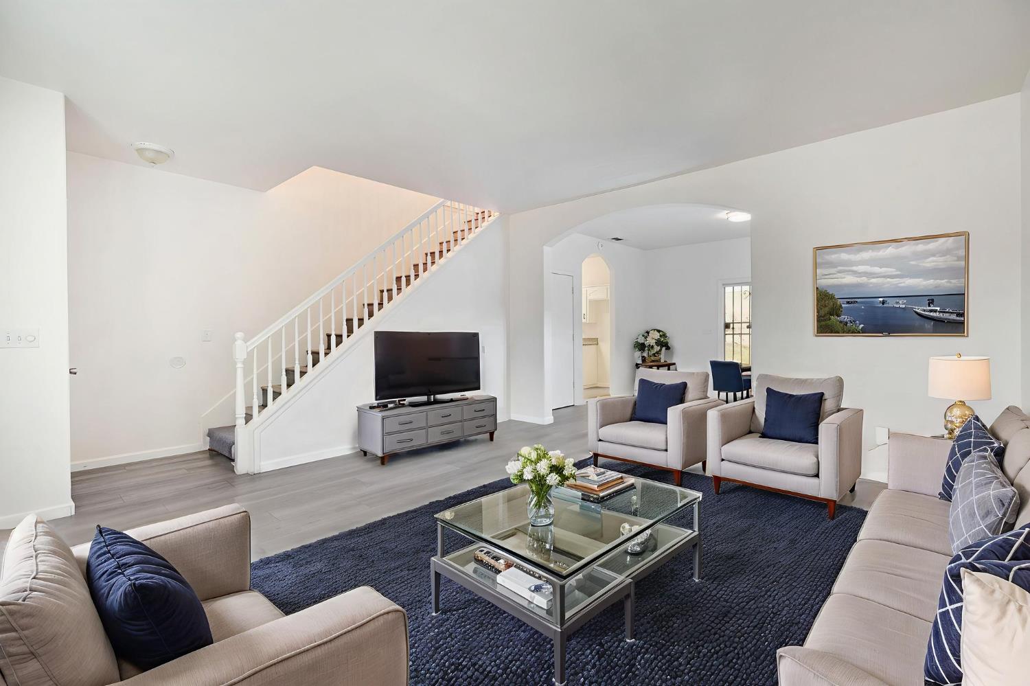 2061 Seventh Street Fresno, CA 93702 - Photo 24 of 38 a living room with furniture a rug and a flat screen tv