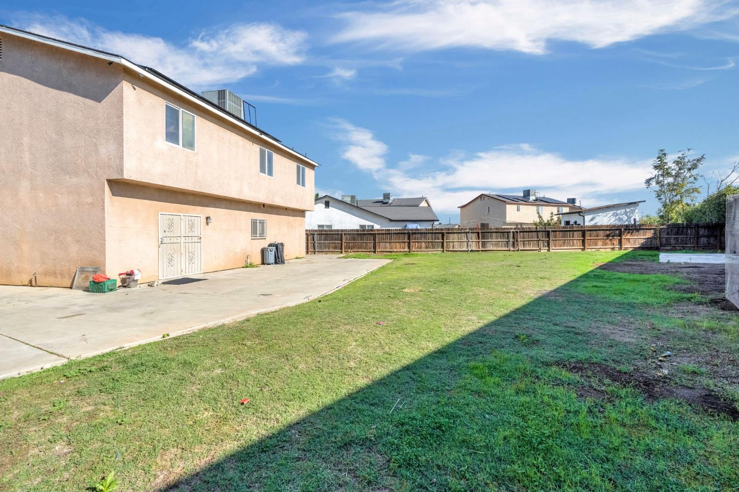 2061 Seventh Street Fresno, CA 93702 - Photo 32 of 38 a view of a house with a yard