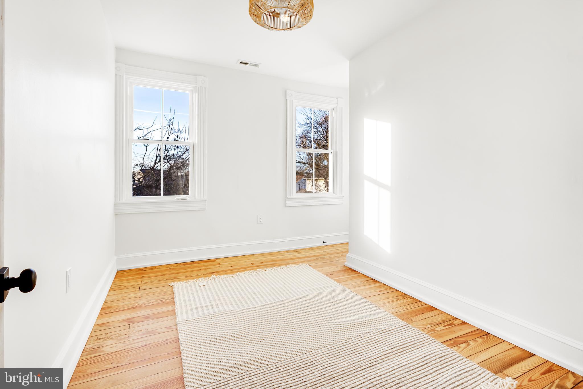 7714 Fairgreen Road Dundalk, MD 21222 - Photo 33 of 38 a view of a room with wooden floor and a window