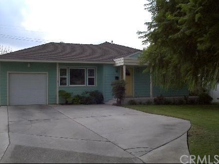 7724 Sycamore Avenue Riverside, CA 92504 - Photo 1 of 1 a backyard of a house with garden and trees