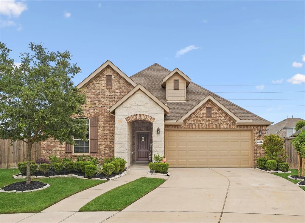 Welcome home to 6822 Greenwood Valley Place in the amenity packed community of Elyson!