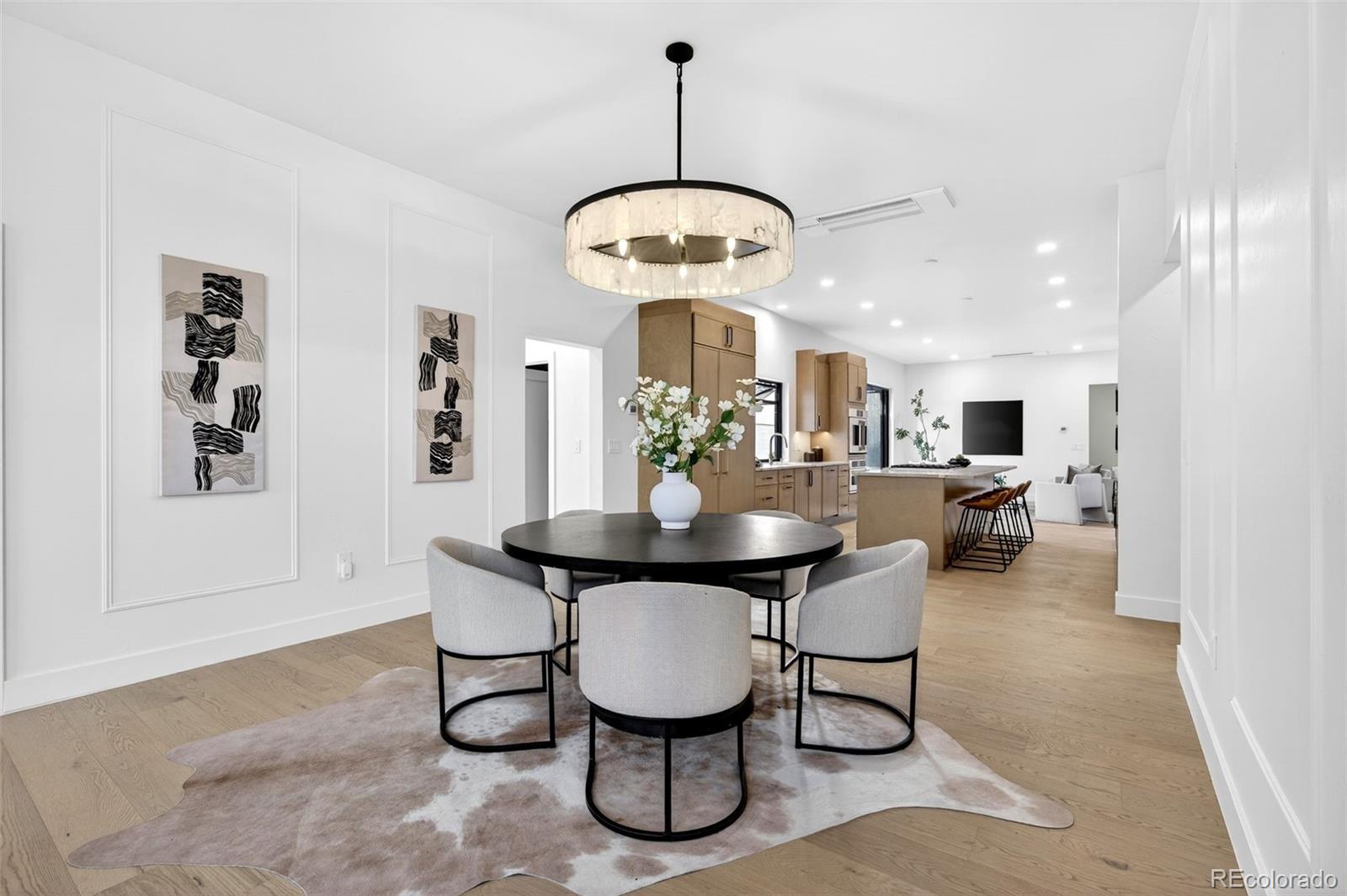 5175 Raleigh Street Denver, CO 80212 - Photo 7 of 49 a view of a dining room with furniture and chandelier