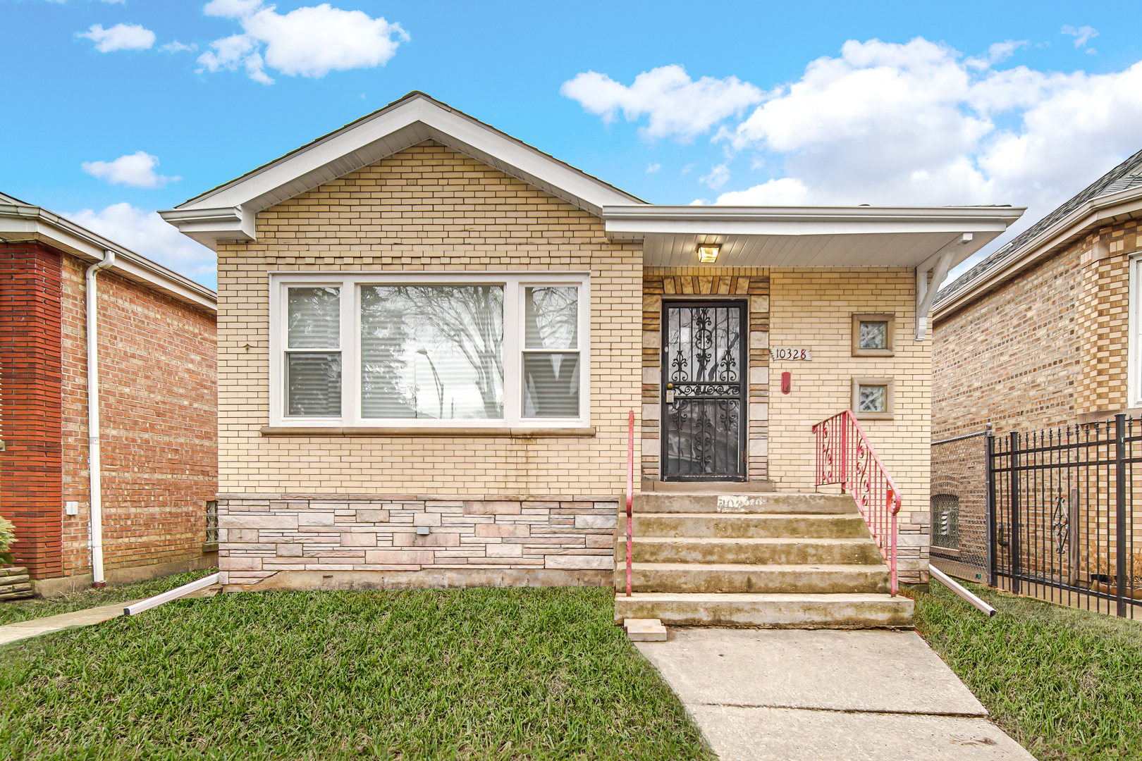 10328 South Union Avenue Chicago, IL 60628 - Photo 1 of 18 a front view of a house with a yard
