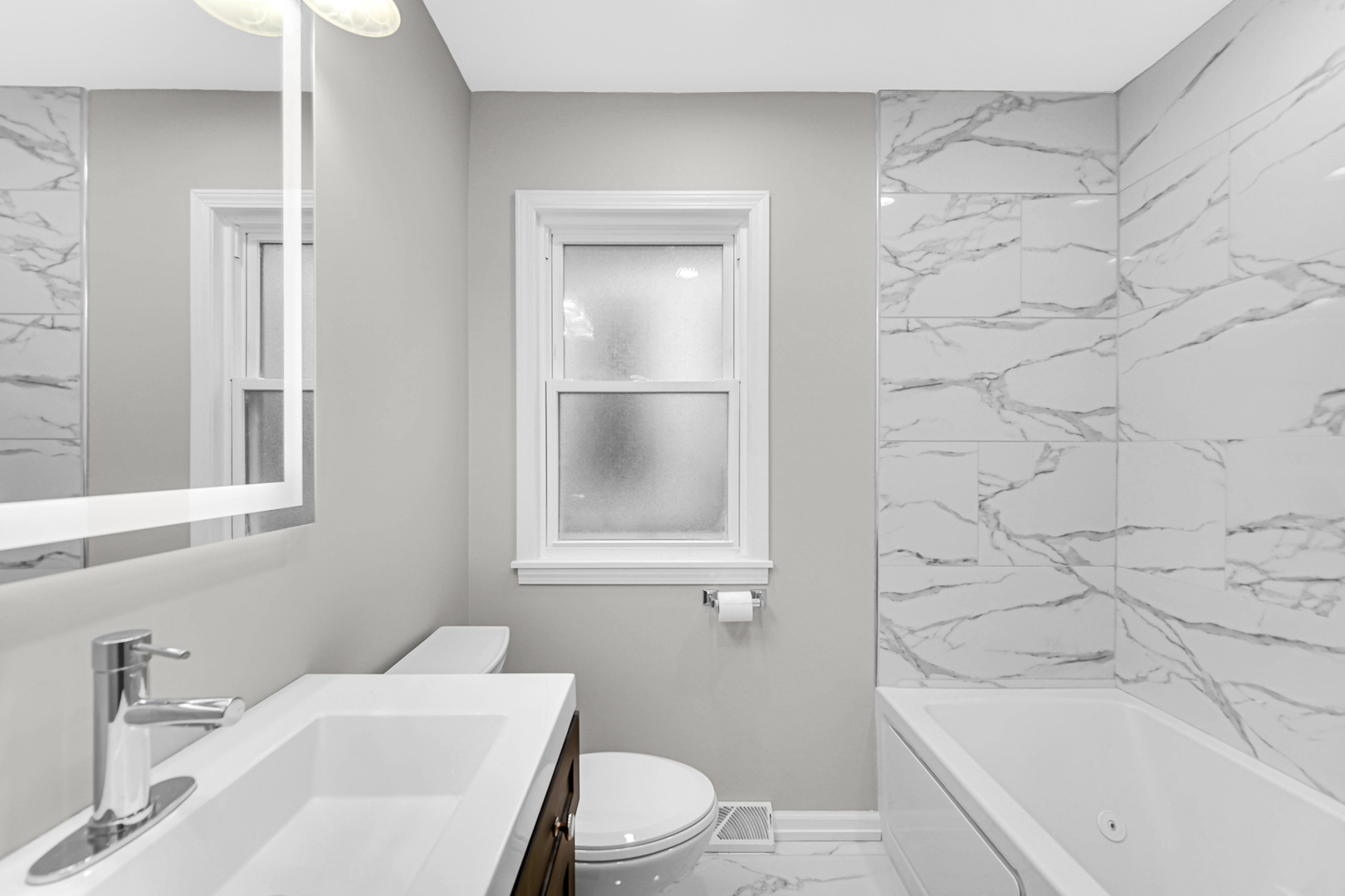 10328 South Union Avenue Chicago, IL 60628 - Photo 11 of 18 a bathroom with a sink a toilet and shower