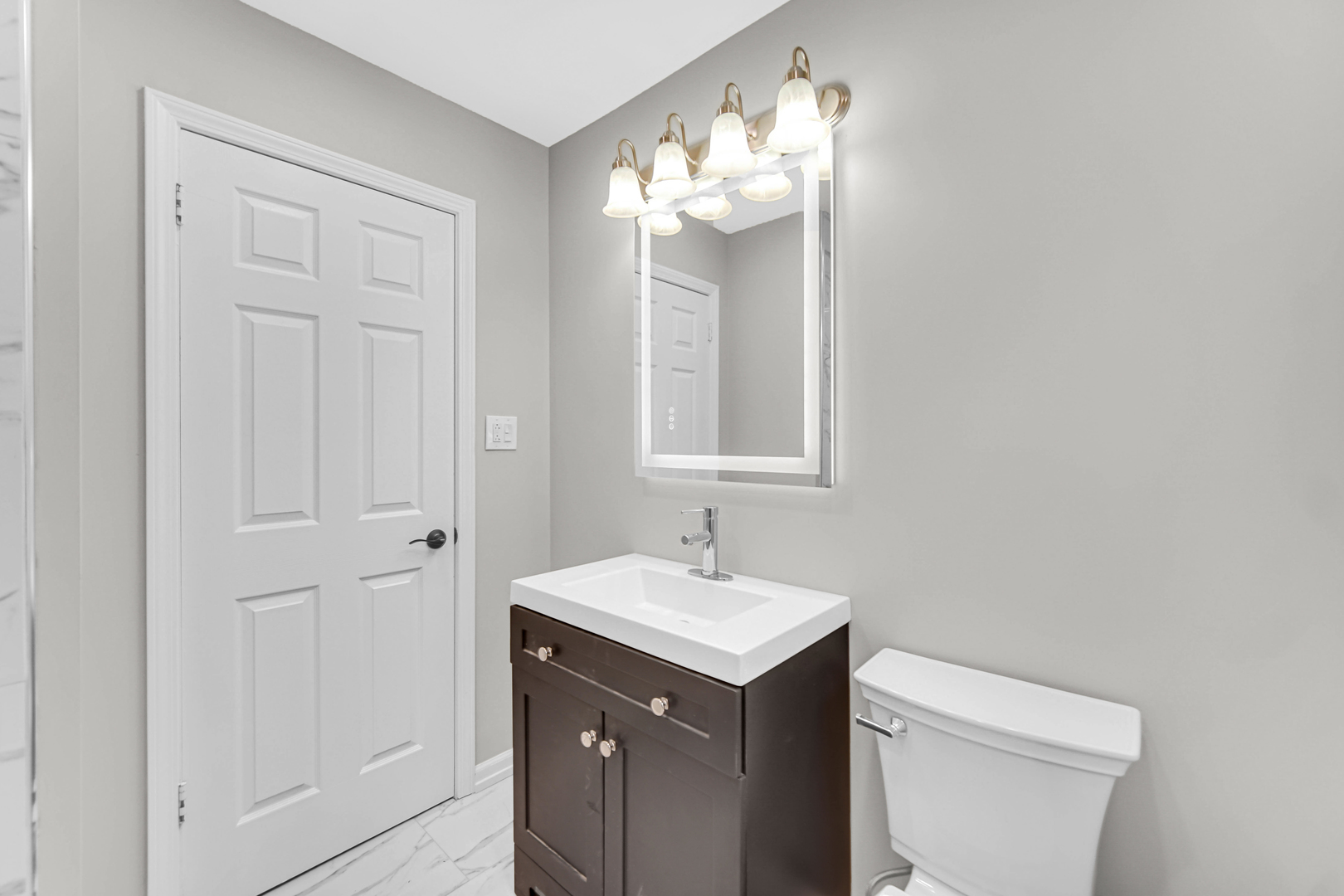 10328 South Union Avenue Chicago, IL 60628 - Photo 12 of 18 a bathroom with a sink and a toilet