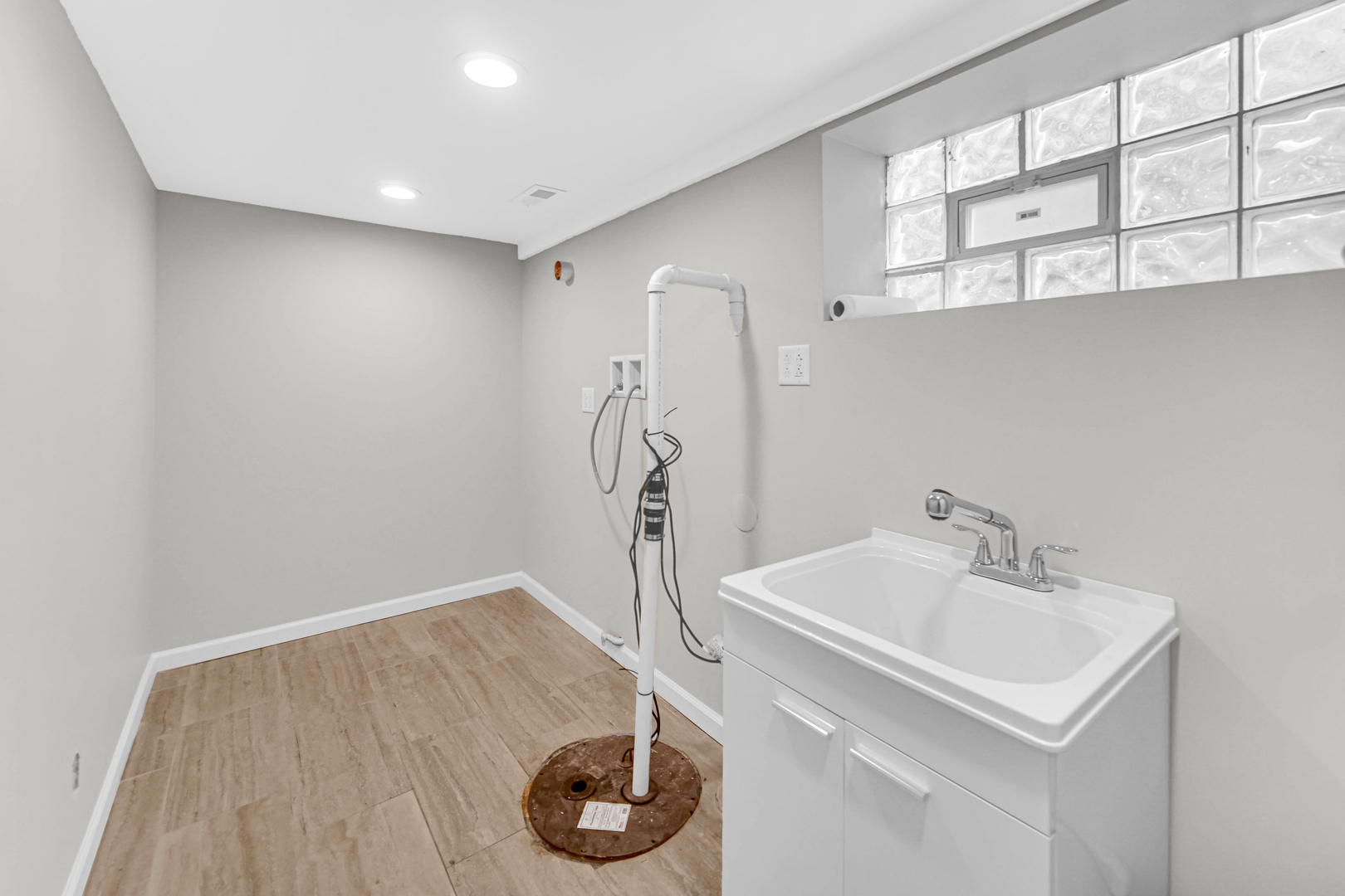 10328 South Union Avenue Chicago, IL 60628 - Photo 17 of 18 a bathroom with a sink and a mirror