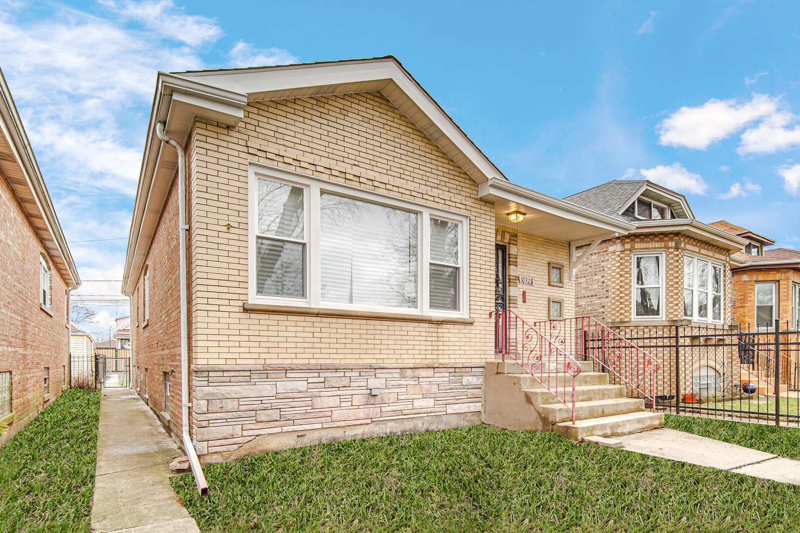 10328 South Union Avenue Chicago, IL 60628 - Photo 2 of 18 front view of a house with a yard