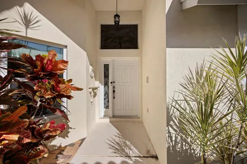 a view of a dining room with furniture wooden floor and chandelier