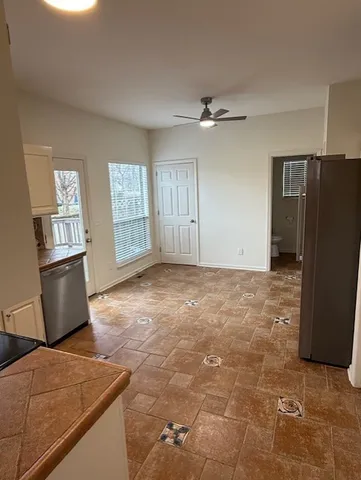 a view of livingroom with hardwood floor and a ceiling fan
