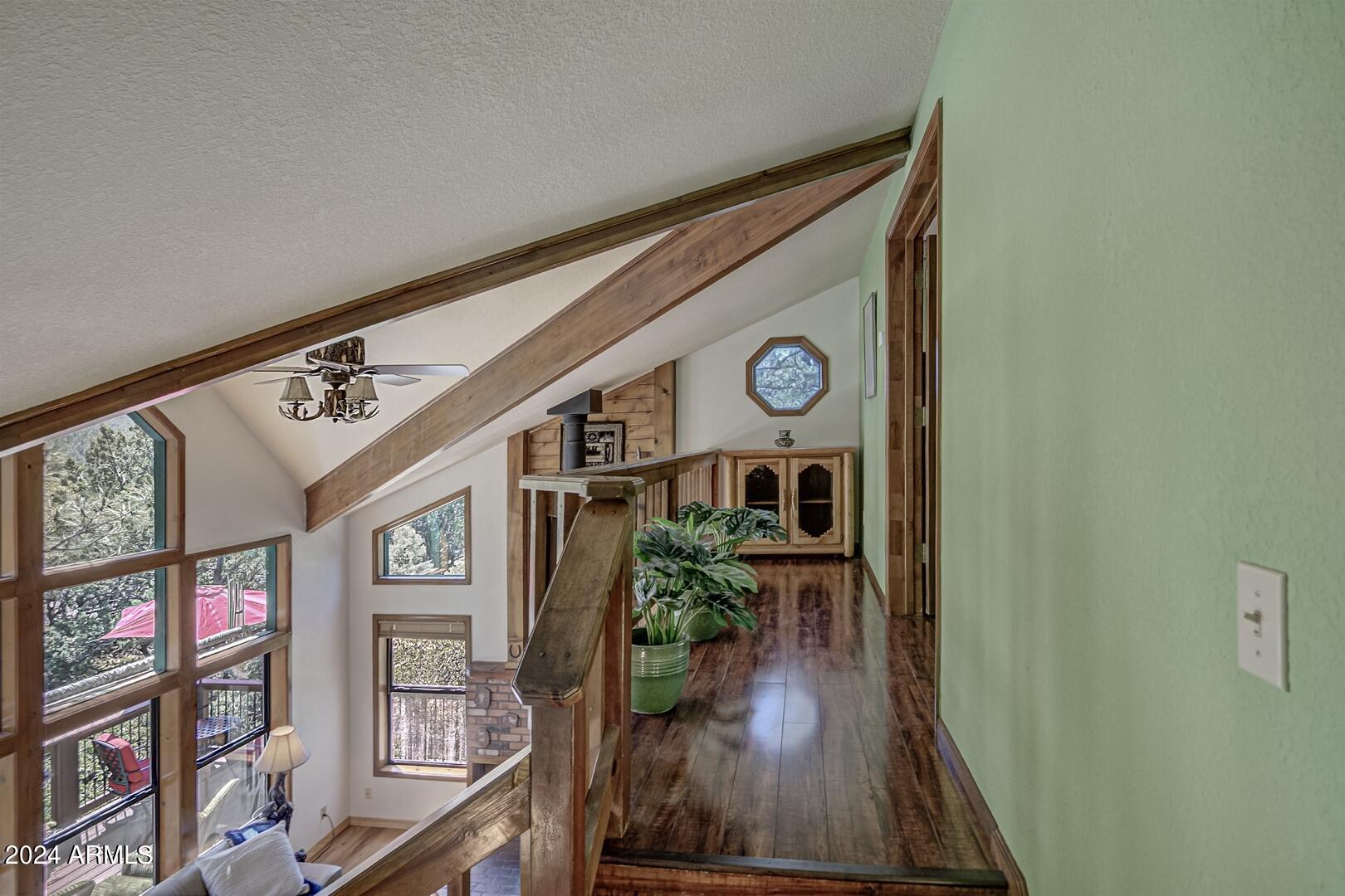 6010 Arroyo Way Pine, AZ 85544 - Photo 14 of 52 a view of entryway and hall with wooden floor