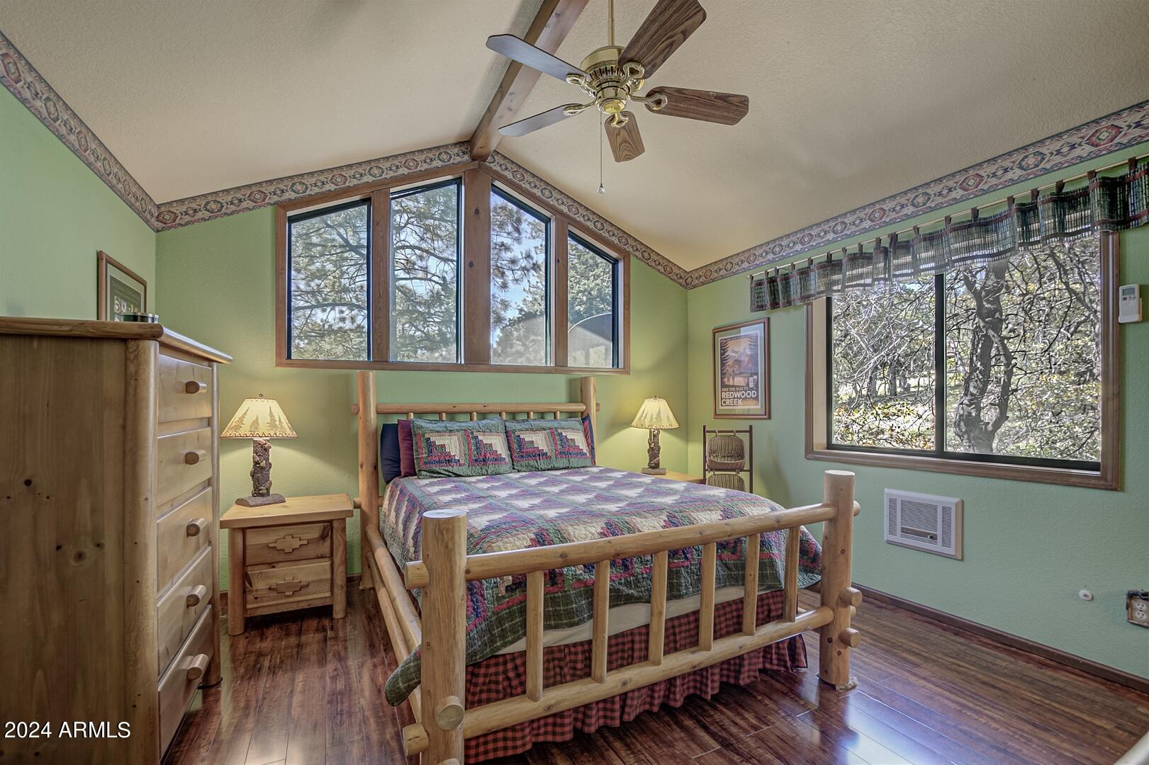 6010 Arroyo Way Pine, AZ 85544 - Photo 15 of 52 a bedroom with a bed table and a window