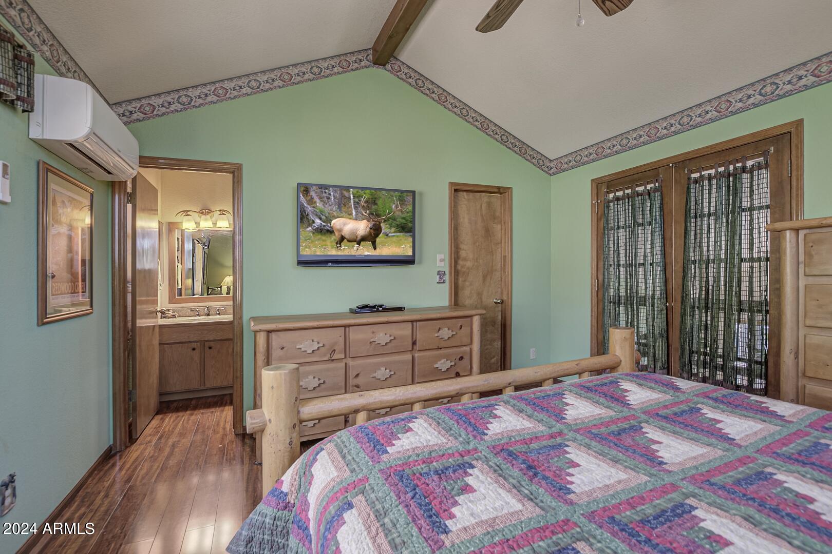 6010 Arroyo Way Pine, AZ 85544 - Photo 16 of 52 a bedroom with a bed and a dresser