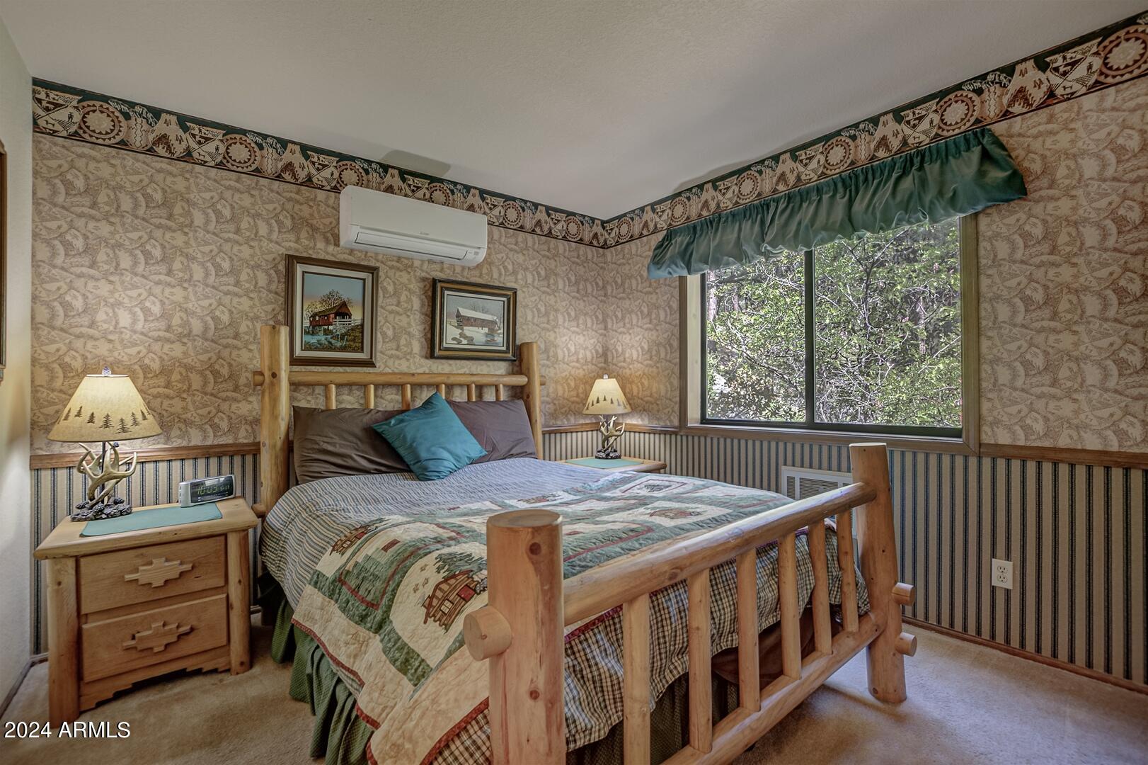 6010 Arroyo Way Pine, AZ 85544 - Photo 21 of 52 a bedroom with a bed and a window