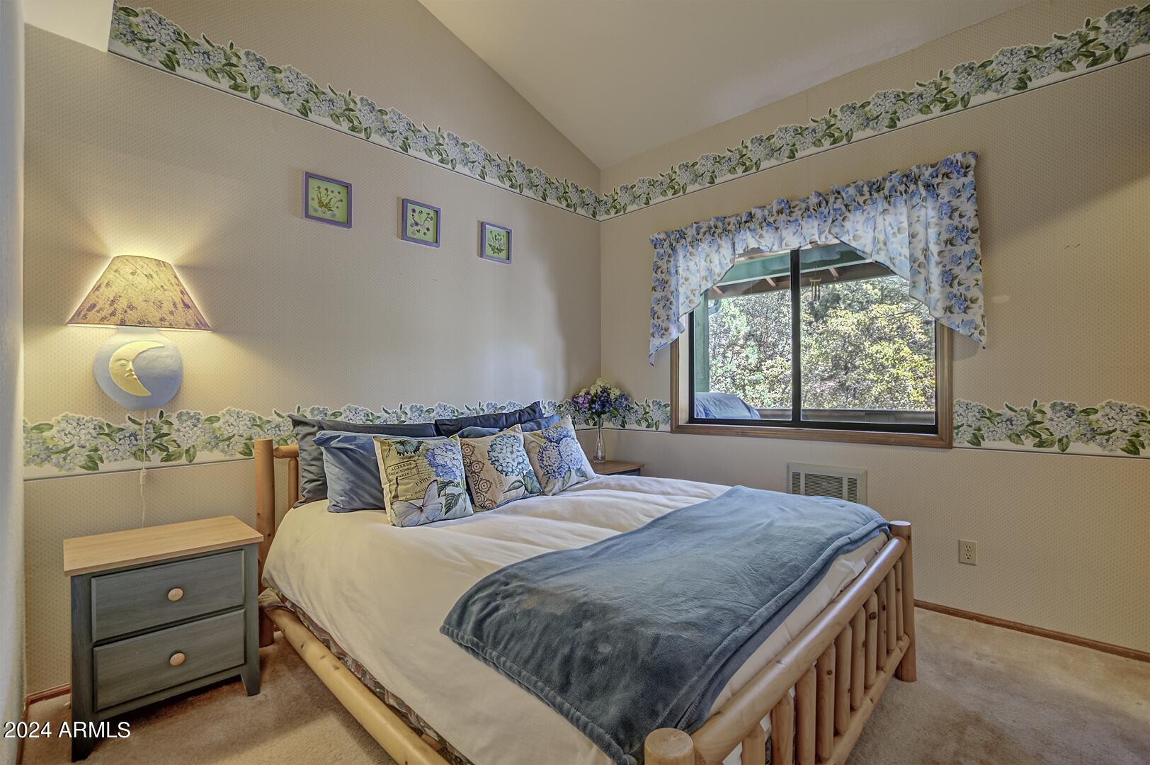 6010 Arroyo Way Pine, AZ 85544 - Photo 22 of 52 a bedroom with a bed and a window