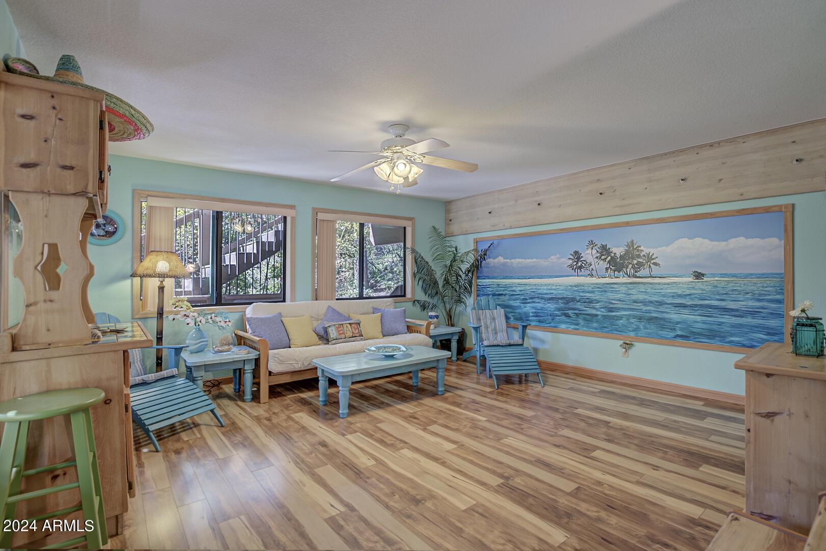 6010 Arroyo Way Pine, AZ 85544 - Photo 27 of 52 a living room with furniture and wooden floor