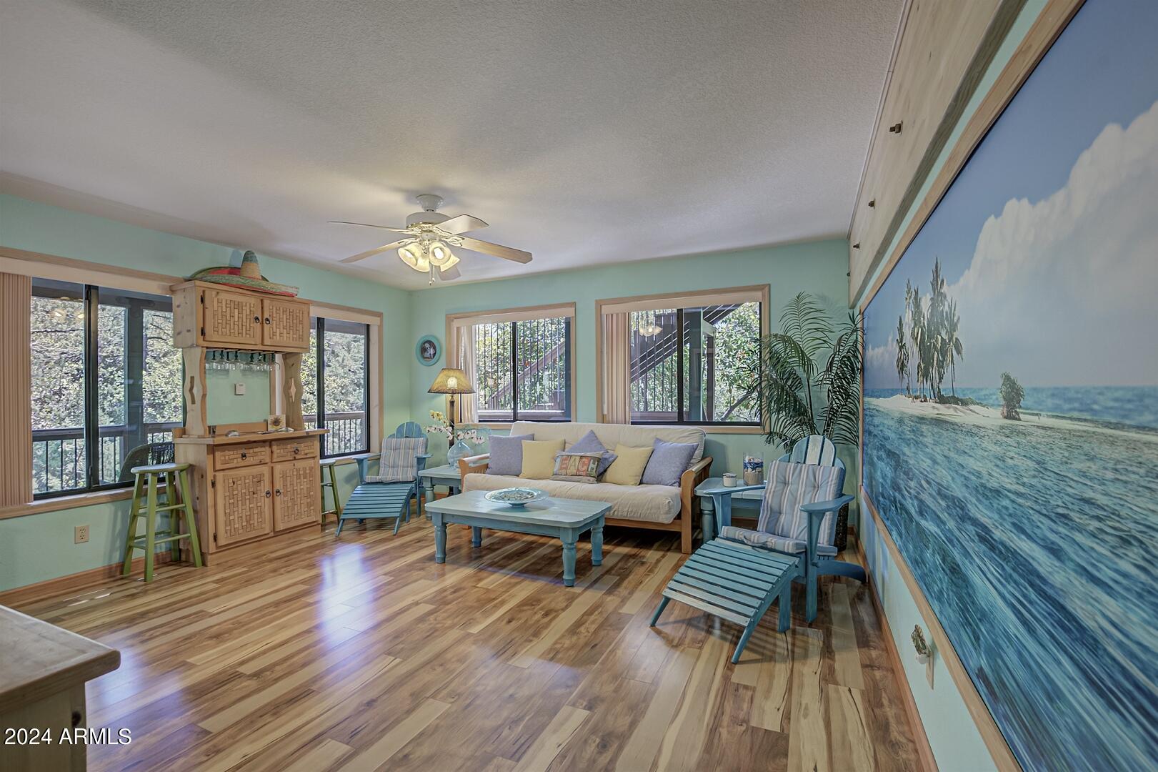 6010 Arroyo Way Pine, AZ 85544 - Photo 29 of 52 a living room with furniture and wooden floor