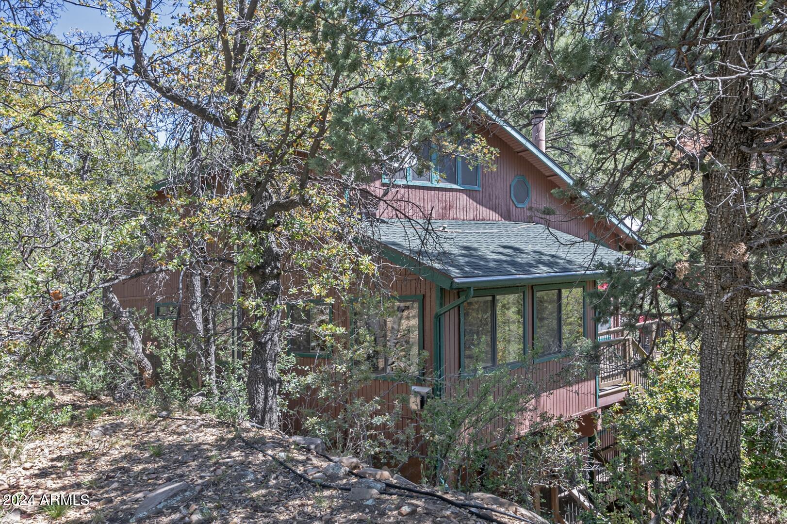 6010 Arroyo Way Pine, AZ 85544 - Photo 37 of 52 a house with trees in front of it