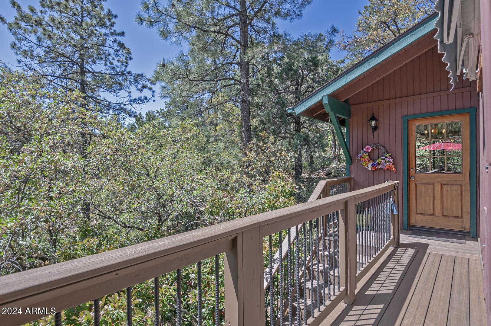 6010 Arroyo Way Pine, AZ 85544 - Photo 39 of 52 a view of a balcony with wooden floor