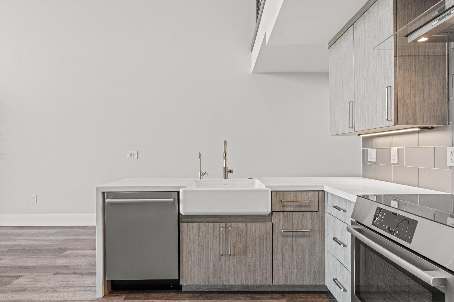 1818 L Street, Unit 807 Sacramento, CA 95811 - Photo 11 of 39 a kitchen with cabinets and white appliances