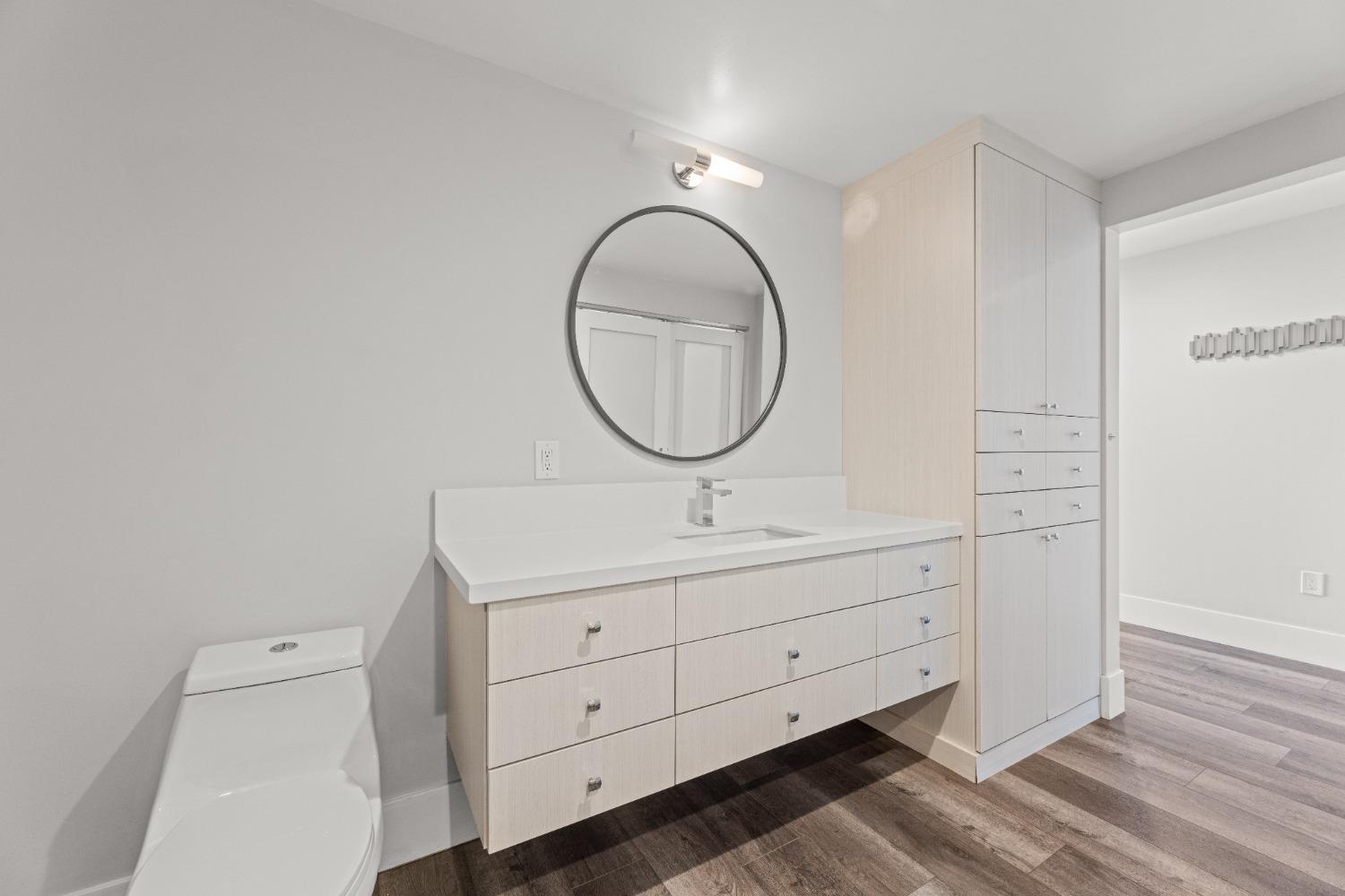 1818 L Street, Unit 807 Sacramento, CA 95811 - Photo 18 of 39 a bathroom with a sink and a mirror