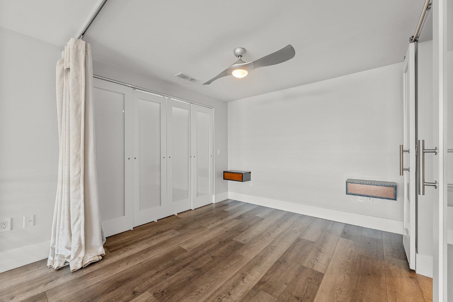 1818 L Street, Unit 807 Sacramento, CA 95811 - Photo 27 of 39 a view of empty room with wooden floor