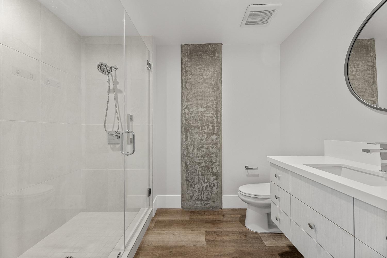 1818 L Street, Unit 807 Sacramento, CA 95811 - Photo 33 of 39 a bathroom with a sink a toilet and shower