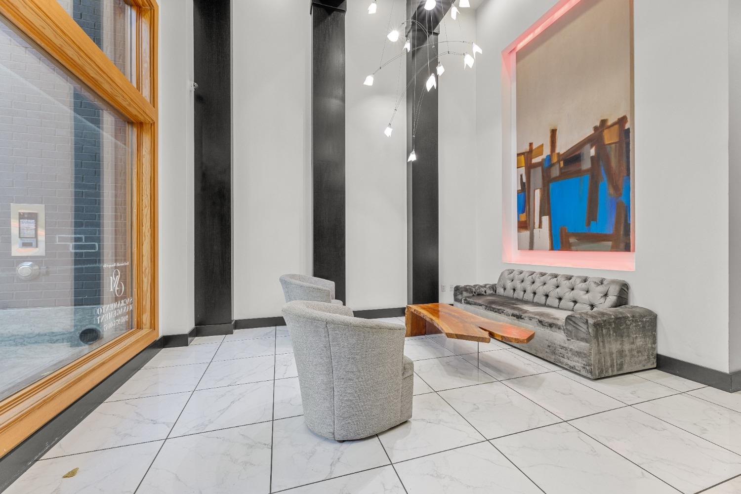 1818 L Street, Unit 807 Sacramento, CA 95811 - Photo 38 of 39 a living room with a couch and a table