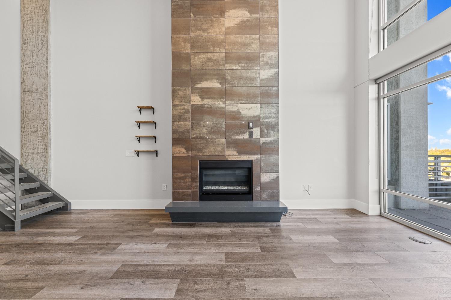 1818 L Street, Unit 807 Sacramento, CA 95811 - Photo 6 of 39 an empty room with fireplace