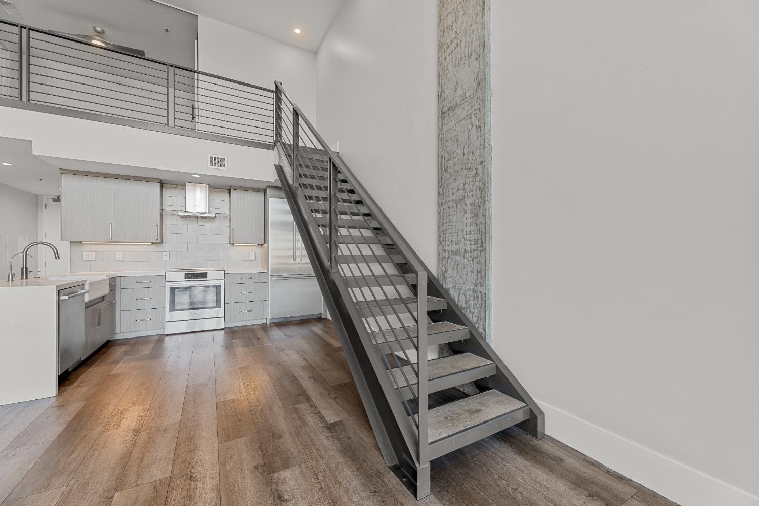 1818 L Street, Unit 807 Sacramento, CA 95811 - Photo 8 of 39 a view of kitchen with sink and wooden floor