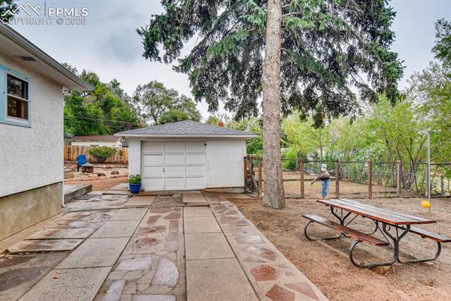 917 Prairie Road Colorado Springs, CO 80909 - Photo 26 of 27 Oversized garage is 677 sqft
