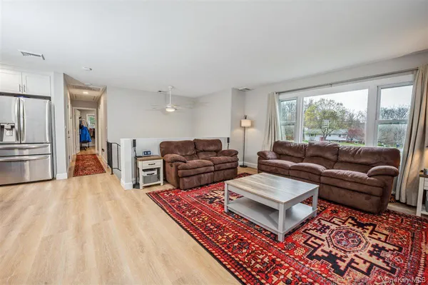 a living room with furniture and a rug